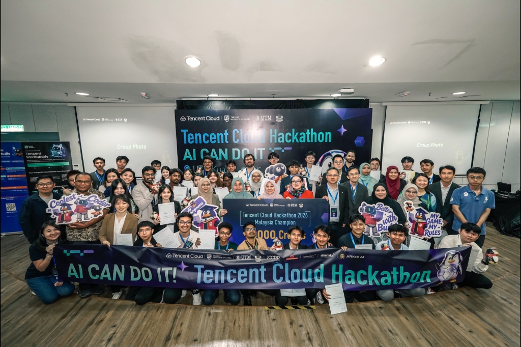 All hackathon participants, mentors, judges, and winners gathered on stage holding the Malaysia Champion board and banners at the Tencent Cloud Hackathon 2026 closing ceremony.